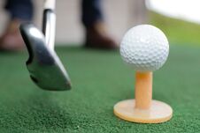 Golf Balls And Golf Club On Green Grass Stock Photography