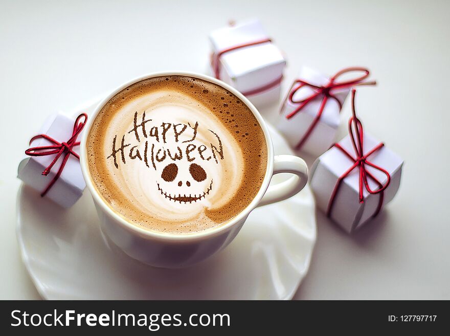 Cup of coffee with the inscription happy halloween. Cup of coffee with the inscription happy halloween