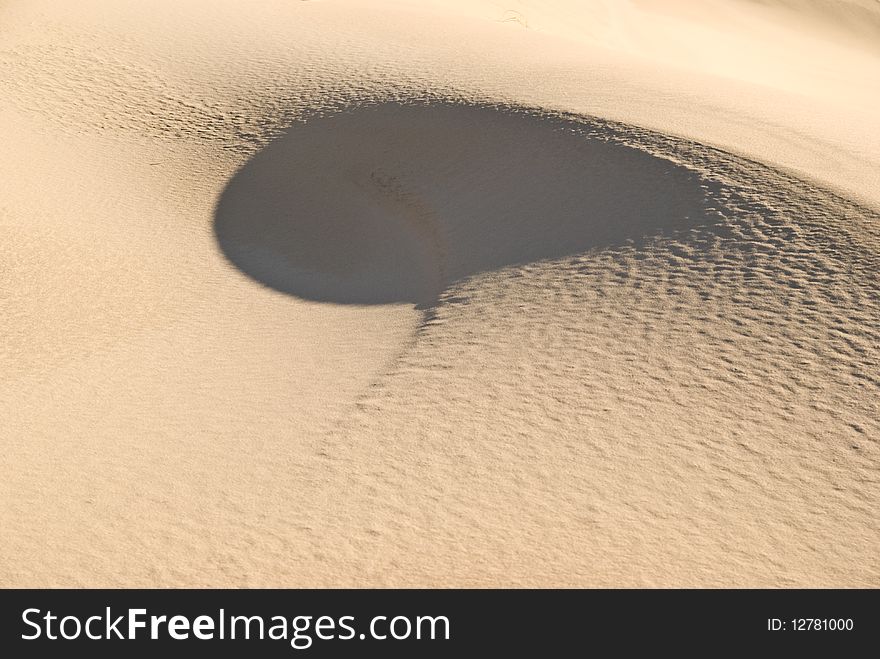 A unique sand swirl formed in the dunes at Death Valley National Park, California