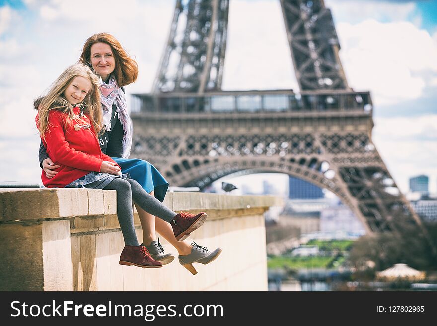 happy travel. Mom and daughter on the background of the Eiffel Tower in Paris. France