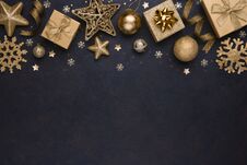 Golden Snowflakes, Gifts, Christmas Balls And Stars On Dark Background Stock Image