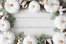 Autumn Frame Of White Pumpkins And Leaves Over Rustic White Wood Royalty Free Stock Photos