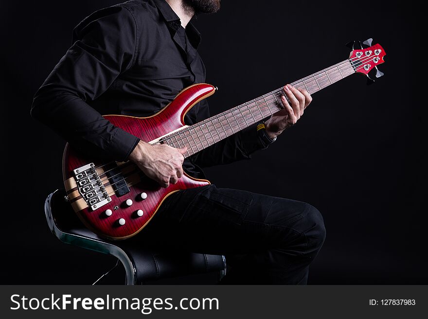 Man Playing Electric Bass Guitar with Slap Technique