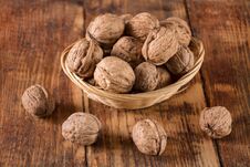 Walnuts In Retro Bowl And Spilled On Wooden Desk Stock Images Walnuts In Retro Bowl And Spilled On Wooden Desk Stock Images