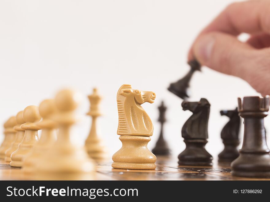 Chess photographed on a chessboard with a neutral background