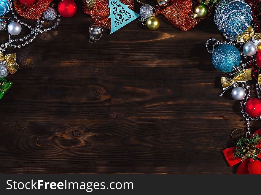 Christmas dark wooden background. Christmas toys. Christmas decorations.