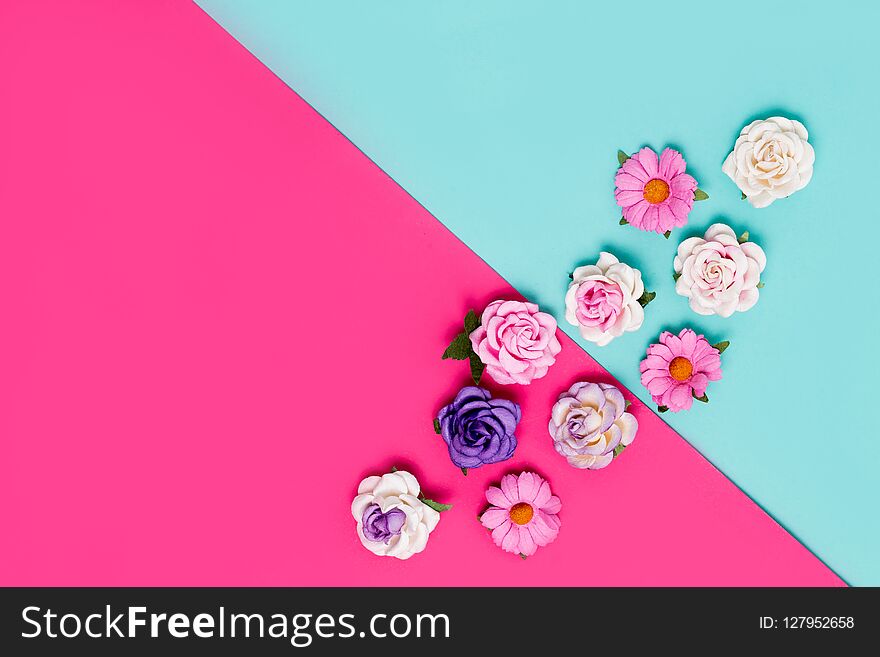 Horizontal colorful background with flowers. pink and blue, top view.