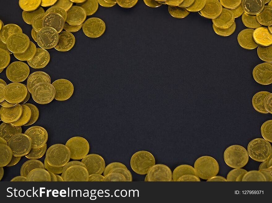 Piles of coins on black background, business and financial concept.