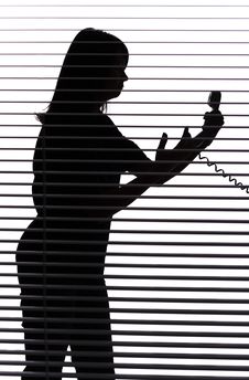 Silhouette Of Woman On The Phone (blind) Stock Photography