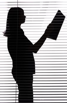 Silhouette Of Woman With Papers Stock Photo