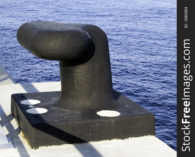 Big black boulder for mooring large yachts or cruise ships