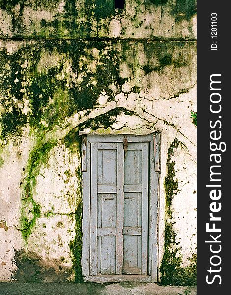 This image is taken during heavy monsoon days in Maharashtra state. Old door with green wall. This image is taken during heavy monsoon days in Maharashtra state. Old door with green wall.