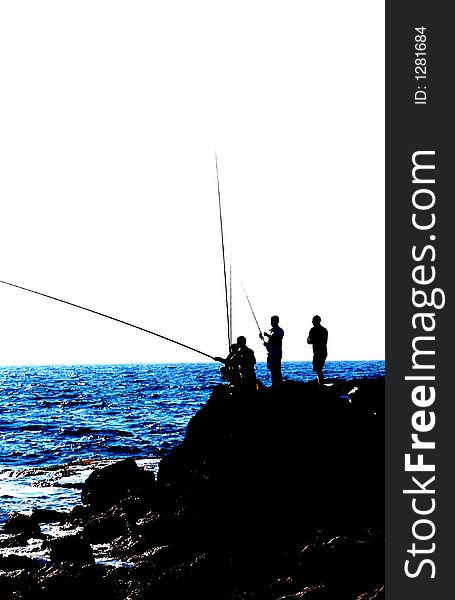 Fishers silhouette in Keisaria antique port , israel