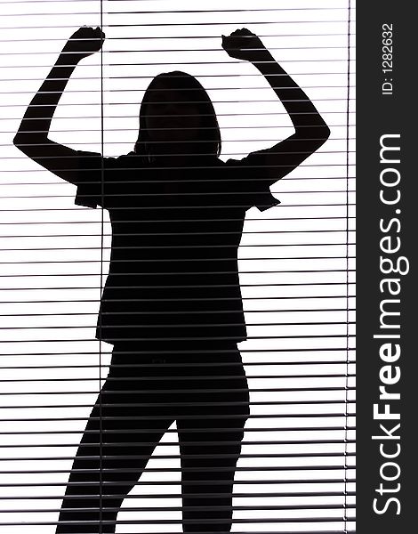 Silhouette of woman with hands up (blind)