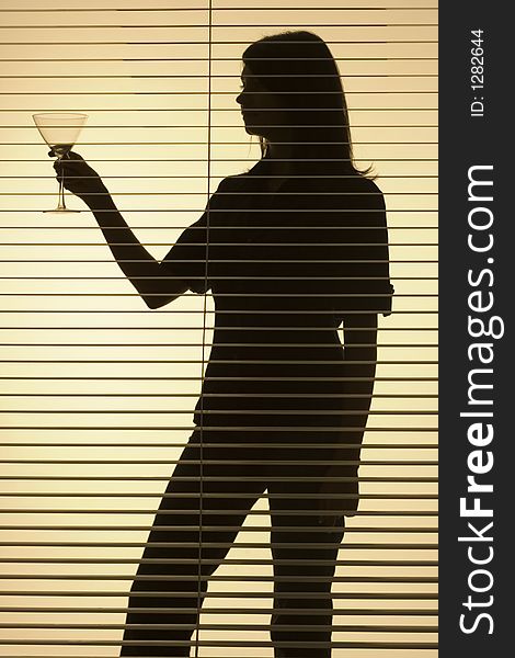 Isolated on gold silhouette of woman with glass (blind)
