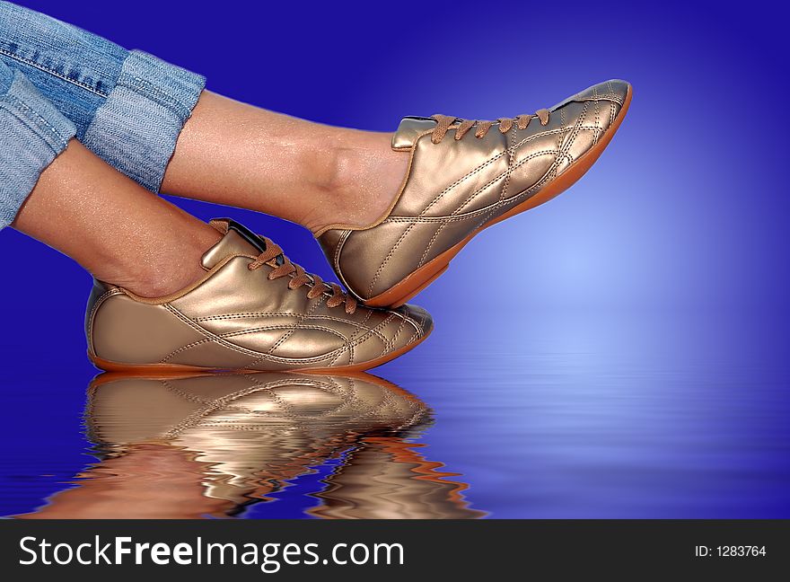 Gold footwear on the water