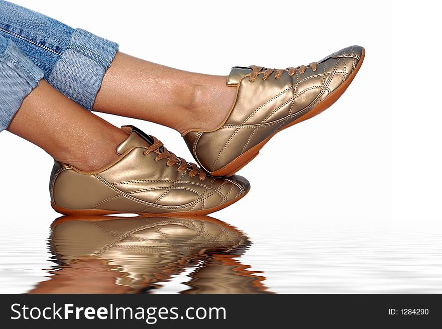 Golden footwear on the water. Golden footwear on the water