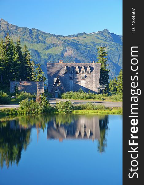 Lodge reflected in a lake in the mountains of Washington State. Lodge reflected in a lake in the mountains of Washington State