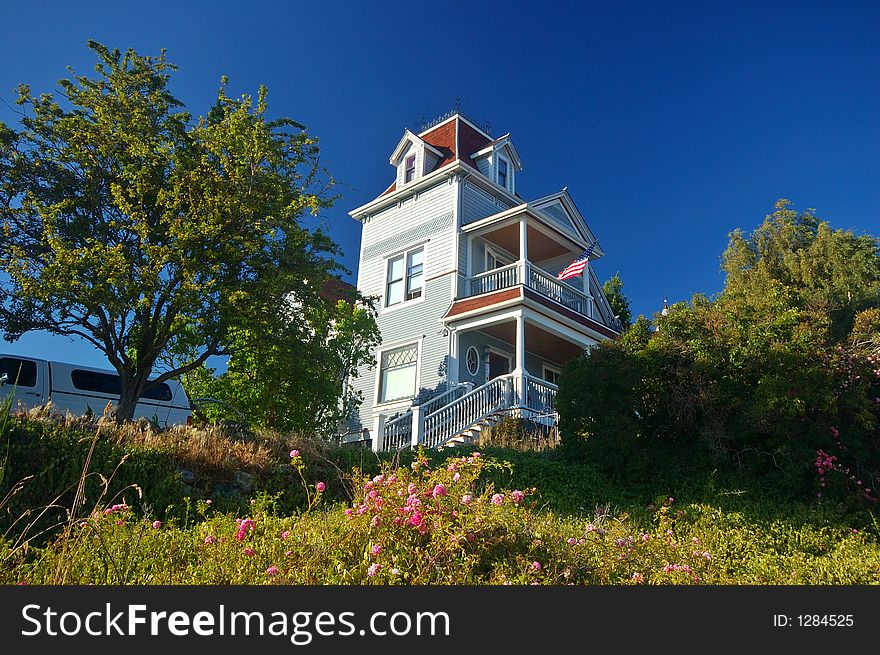 Wooden Victorian style house on a hill. Wooden Victorian style house on a hill