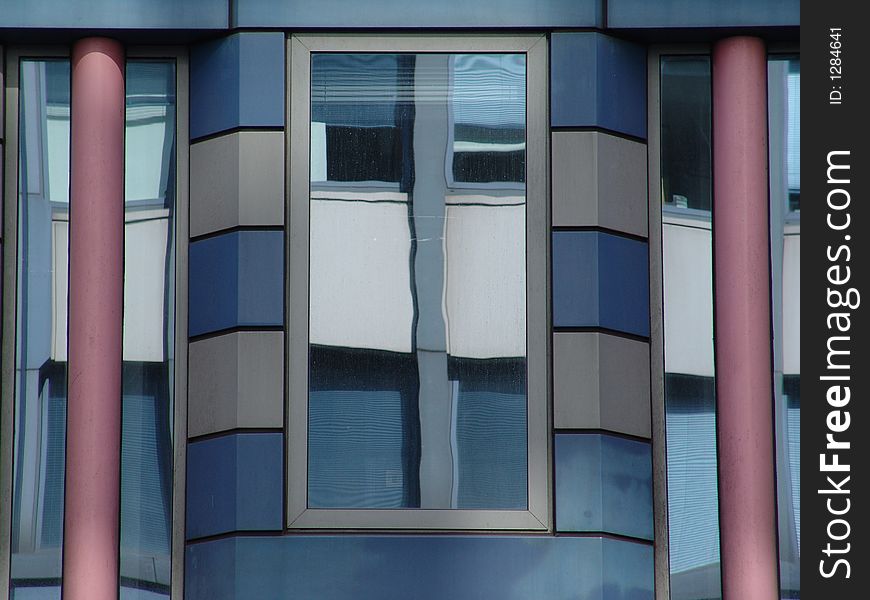Deatail of modern stripy building with glass reflections
