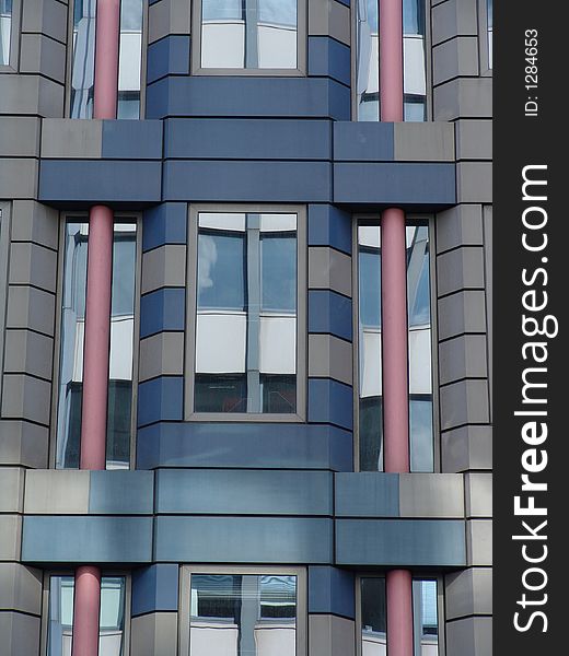 Stripy building with glass reflections