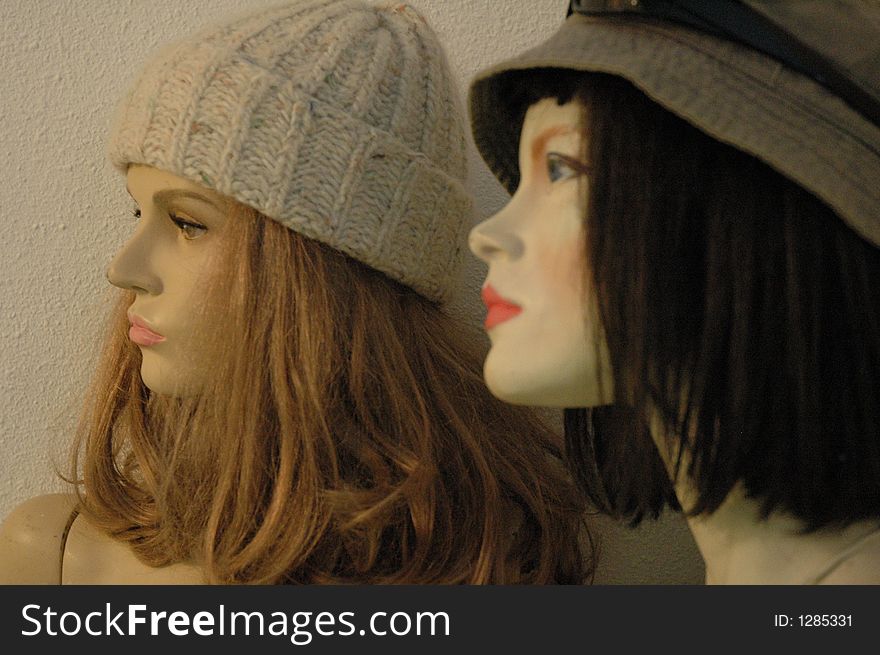 Faces of two damaged female mannequins. Faces of two damaged female mannequins