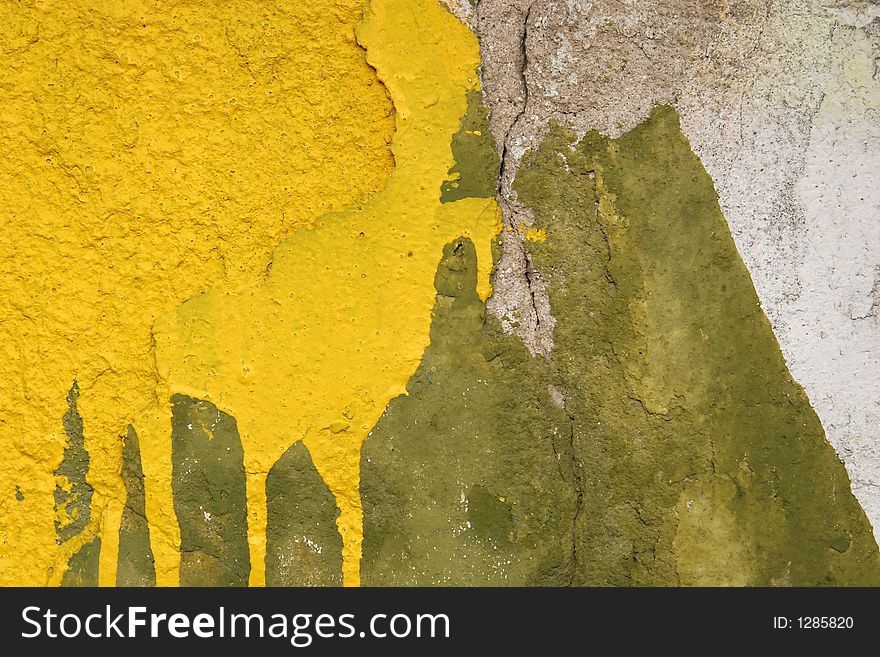 Concrete wall with yellow and green motif