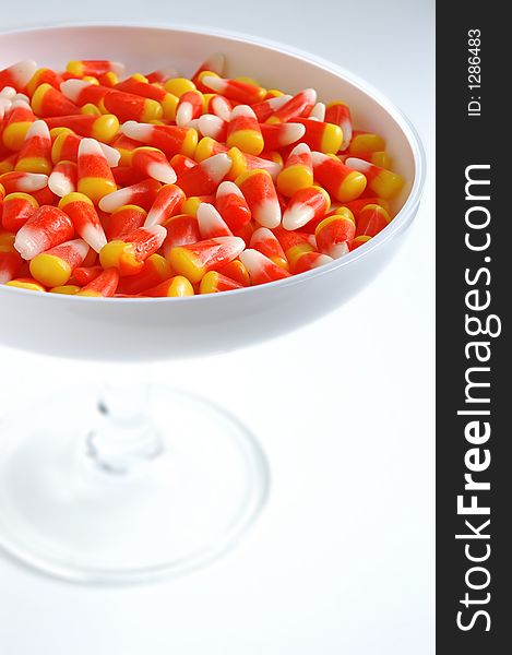 Halloween candy corn in white bowl
