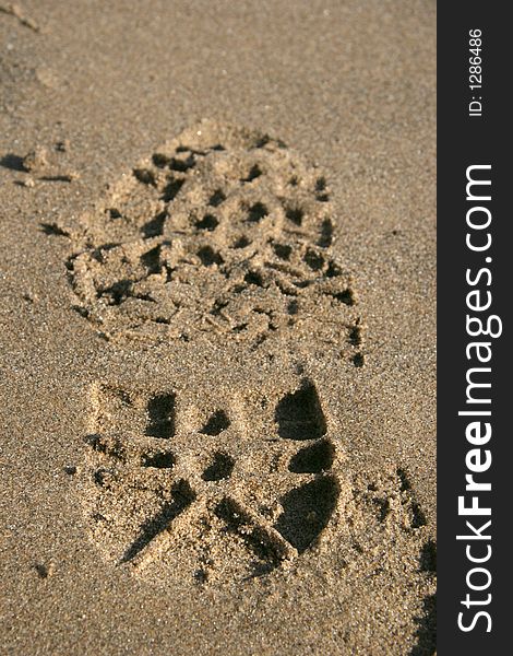 Closeup of Footprint on sand whole. Closeup of Footprint on sand whole