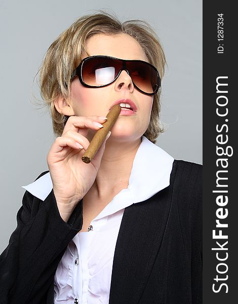 Blond Business Woman Smoking A Cigar