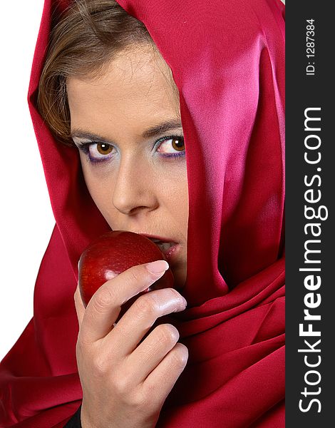 Blond woman in red scarf eating an apple. Blond woman in red scarf eating an apple