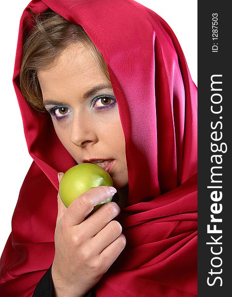 Blond woman in red scarf eating an apple. Blond woman in red scarf eating an apple