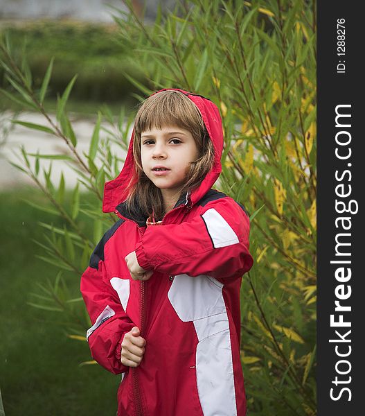 Girl in red jacket in autumn
