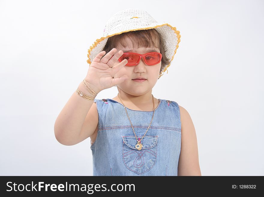 Portrait of a little girl with red sun glasses and hat. Portrait of a little girl with red sun glasses and hat