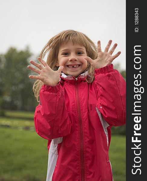 Girl in red jacket in autumn