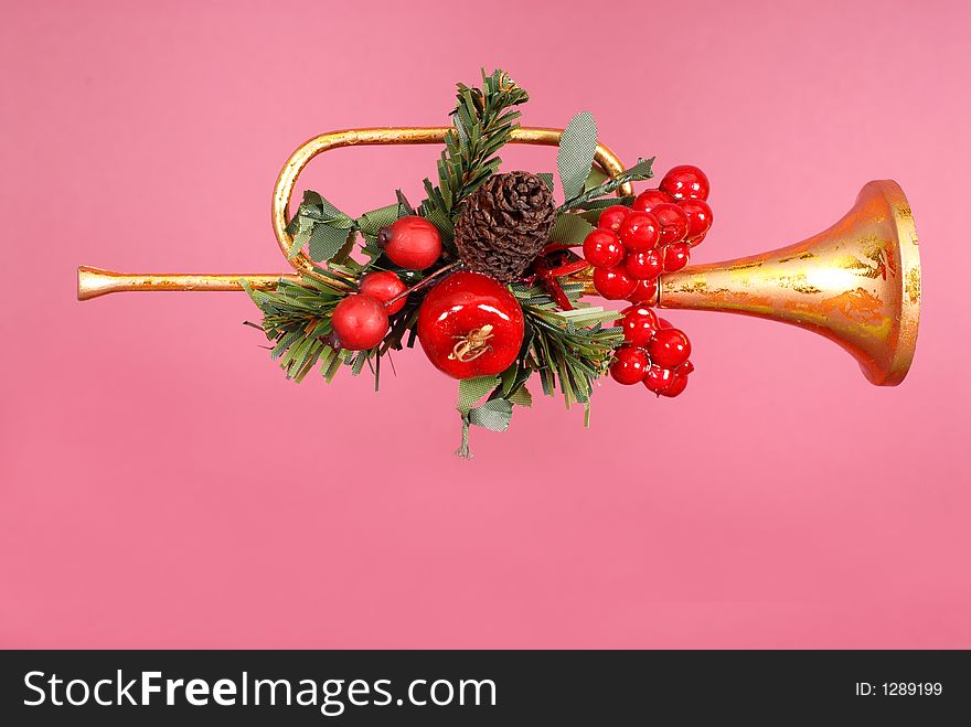 Gold horn Christmas Ornament with holly on Ruby background