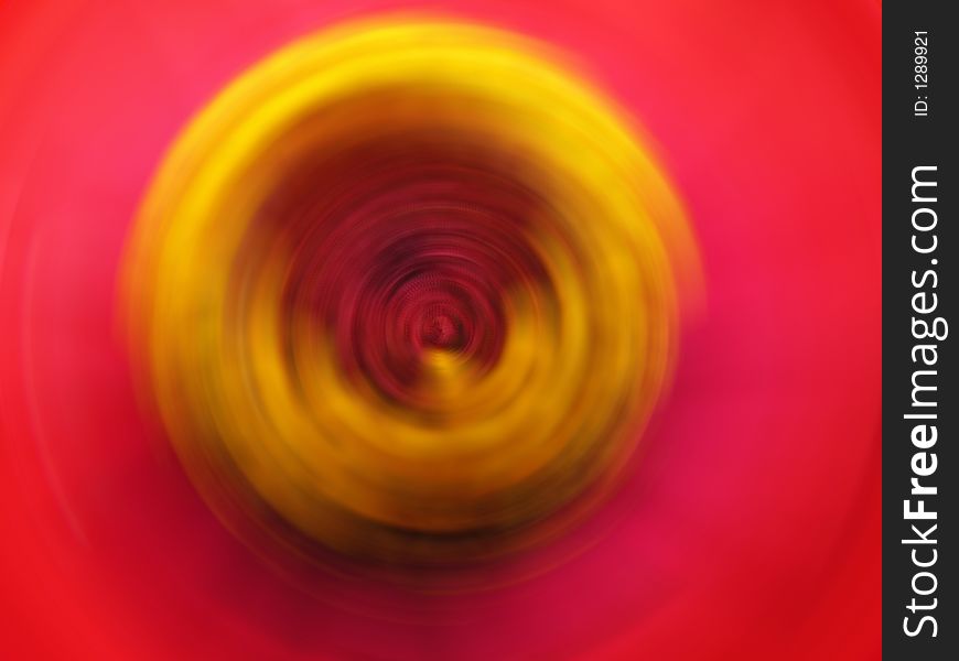 A zinnia flower that is twirled around center of the picture. A zinnia flower that is twirled around center of the picture.