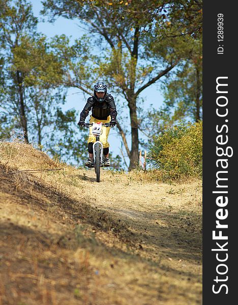 Mountain Biker Girl On Downhill Race