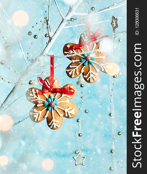 Gingerbread snowflakes for Christmas hanging on a twig