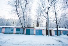 Winter Morning. Chain Of Garages Surrounded By Snow Piles Stock Photo