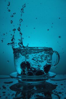 Splash Of Water In A Cup Stock Photography