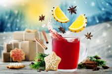 Mulled Wine With Flying Ingredients To Prepare It With Gifts Royalty Free Stock Photos