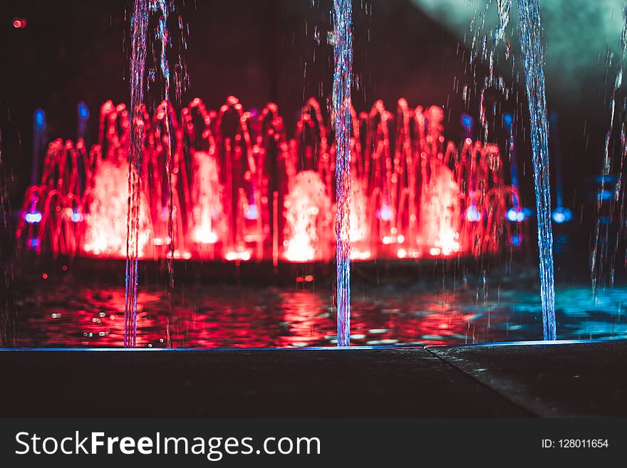 Colored water fountain at night