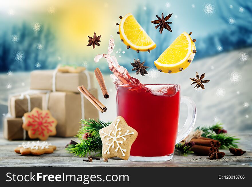 Mulled wine with flying ingredients to prepare it with gifts