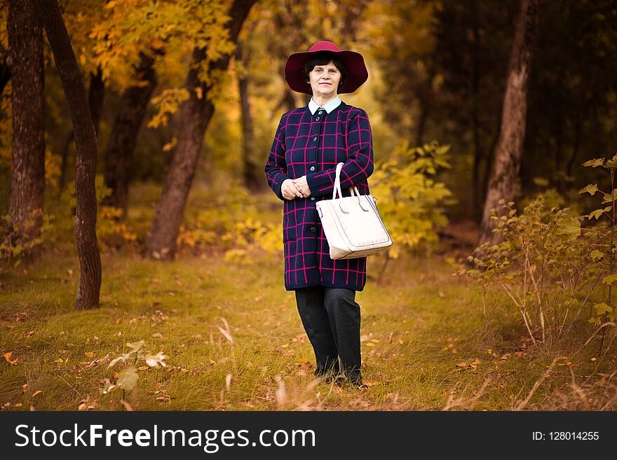 Happy senior woman enjoy autumn. Shopping concept