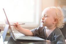 Little Baby Learning To Use Laptop Computer . Royalty Free Stock Photography