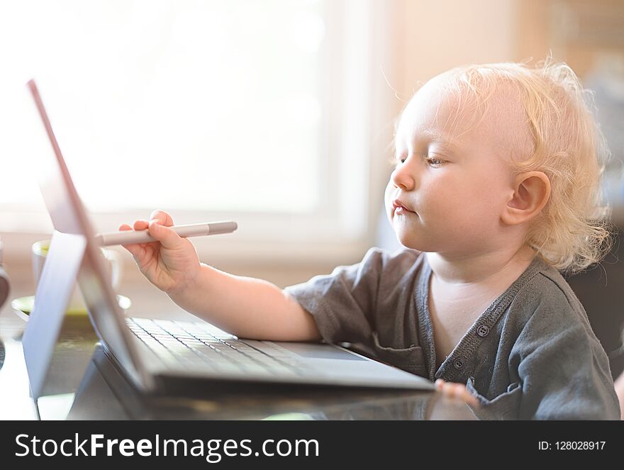 Little Baby Learning To Use Laptop Computer .