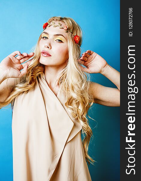 Young blond woman dressed like ancient greek godess, jewelry clo