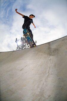 Skateboarder Doing A Tail Slide Stock Image