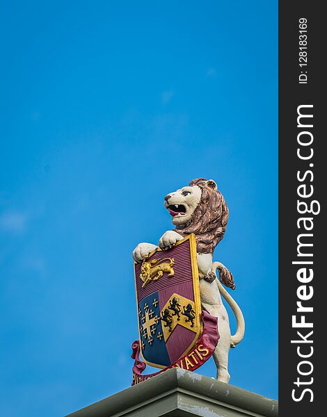 Sculpture of Lion holding city crest symbol standing on the Rochester Bridge over River Medway in Rochester City,Kent, England